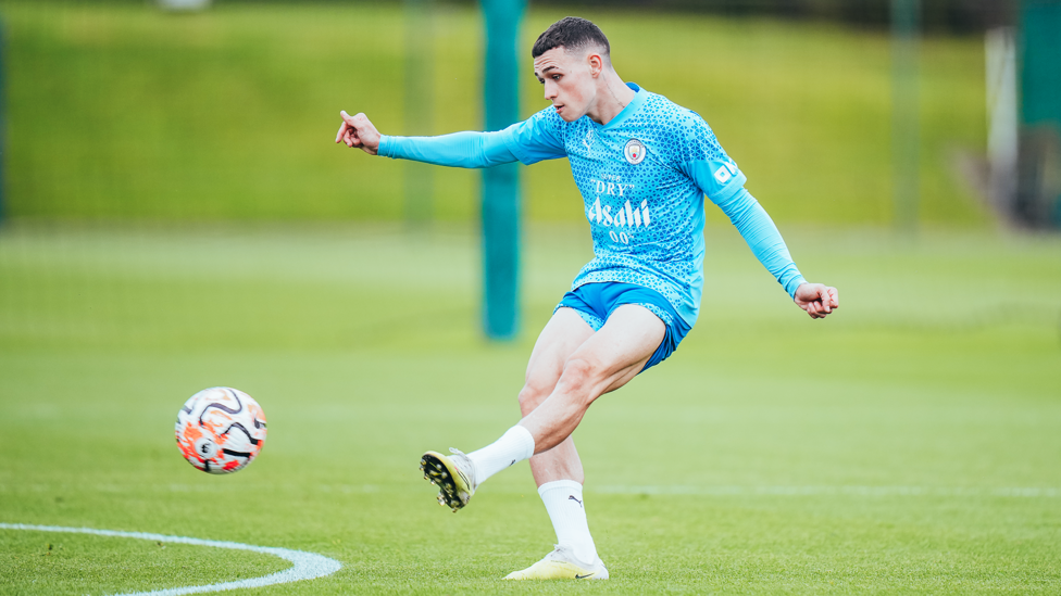 Strike! Phil Foden fires in a shot