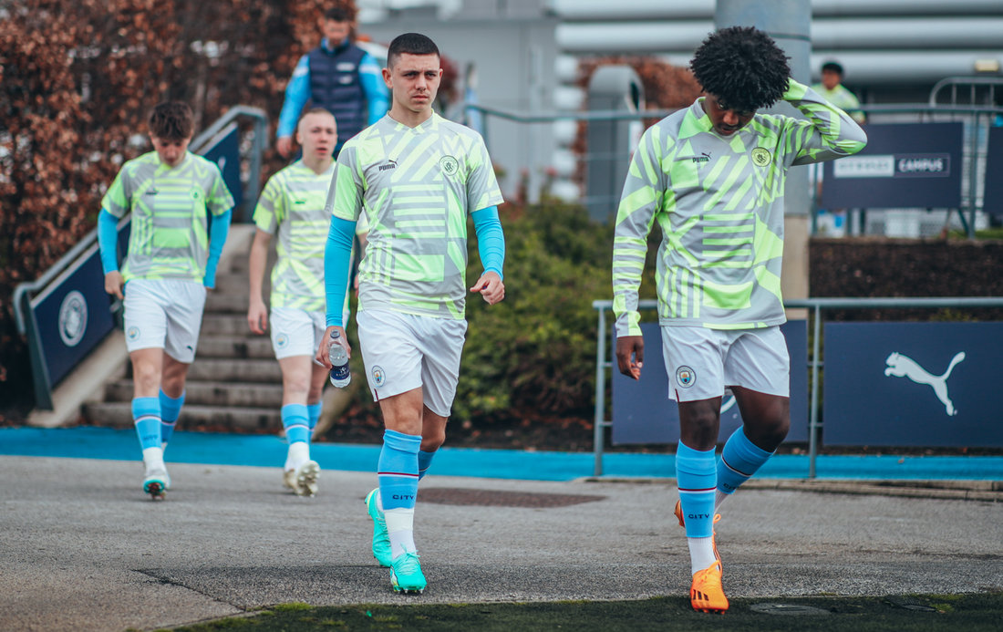 IN THE ZONE: The players walk to the field of play before their pre-match drills. 