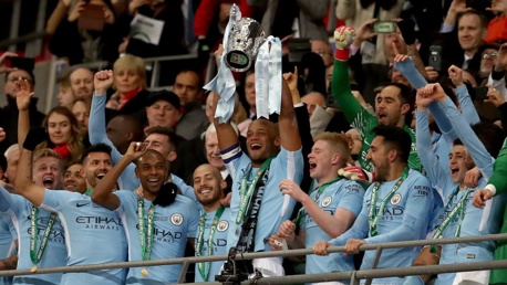 ​CHAMPIONS: Vincent Kompany lifts the Carabao Cup for the third time as City captain
