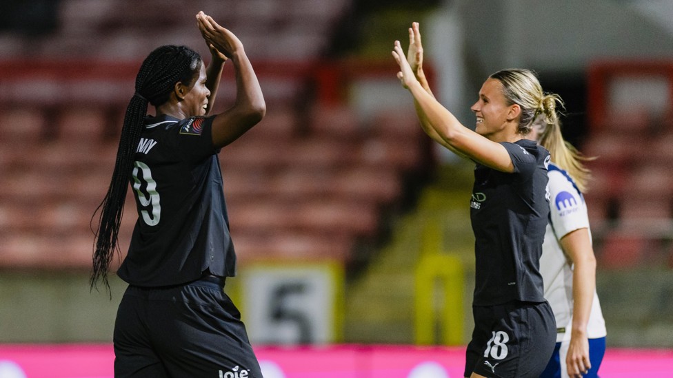 IT'S THREE : Kerstin Casparij is congratulated after heading home her first of the season