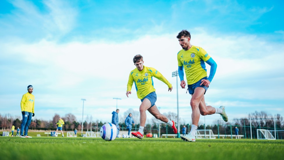 SPRINT RACE  : James McAtee and Ruben Dias dart towards the ball. 