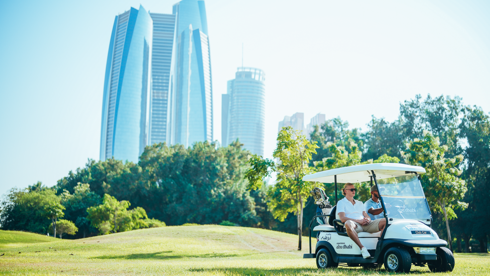 STUNNING SCENERY : Our players enjoy the sights from their golf buggy