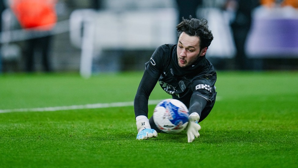SAFE HANDS: James Trafford reaches for the ball