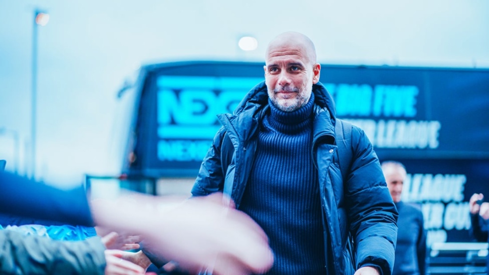 EVENING BOSS: Pep Guardiola greets the supporters