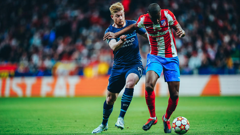 STUCK IN : A very feisty and competitive opening to the match as Kevin battles for the ball. 