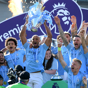 CHAMPIONS: Vincent Kompany lifts City's fourth Premier League trophy aloft