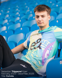 A person sitting in blue stadium seats wearing a patterned sports jersey. Text in the image includes the name 'Sebastian ‘Trippernn’ Kjaer', contract dates, and the title 'Fortnite'.