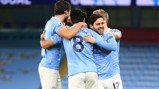 CENTRE OF ATTENTION: The players share the love with Gundogan after his wonderful goal.