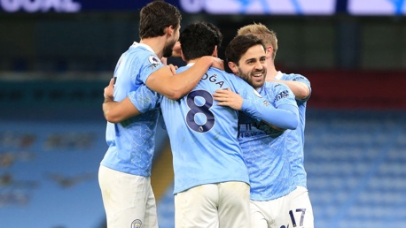 CENTRE OF ATTENTION: The players share the love with Gundogan after his wonderful goal.