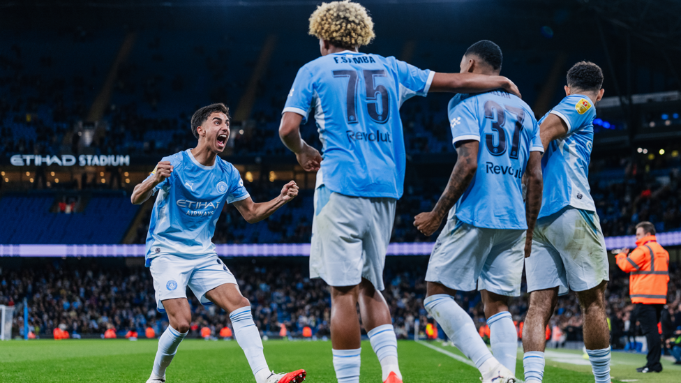 BRAZILIAN BROS : Reis shows his elation after Allan's goal.