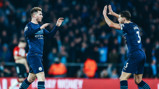 DEFENSIVE DUO: Dias celebrates with Laporte after the equaliser.