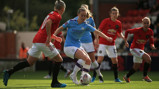 BLUE v RED: City fan Keira Walsh in action against United