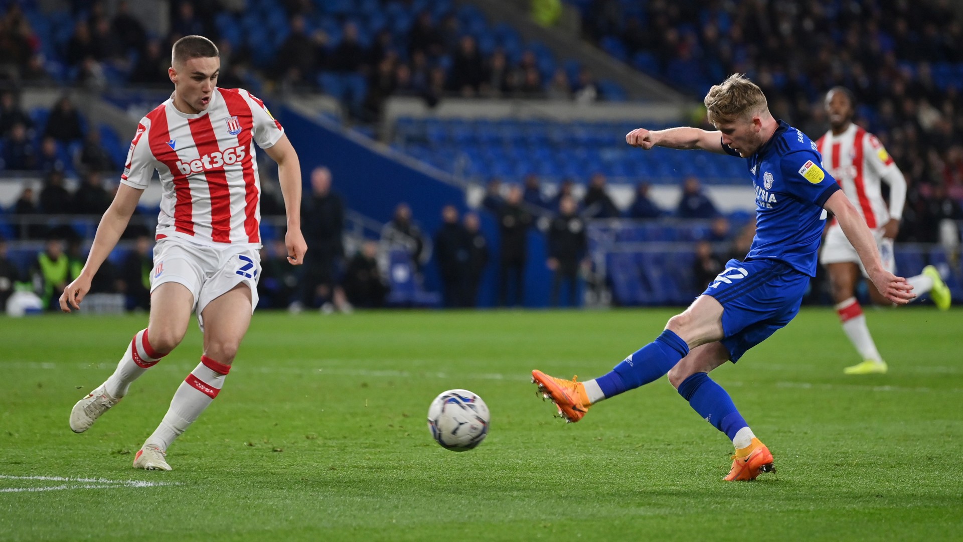 
                        CITY V CITY : Tommy Doyle unleashes a strike as Taylor Harwood-Bellis attempts a block
                