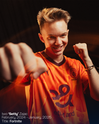 Person in orange Manchester City Esports jersey in a dynamic pose with text about a Fortnite title and dates.