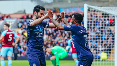HIGH-FIVES: Gundogan shows his appreciation to Sterling after his assist.