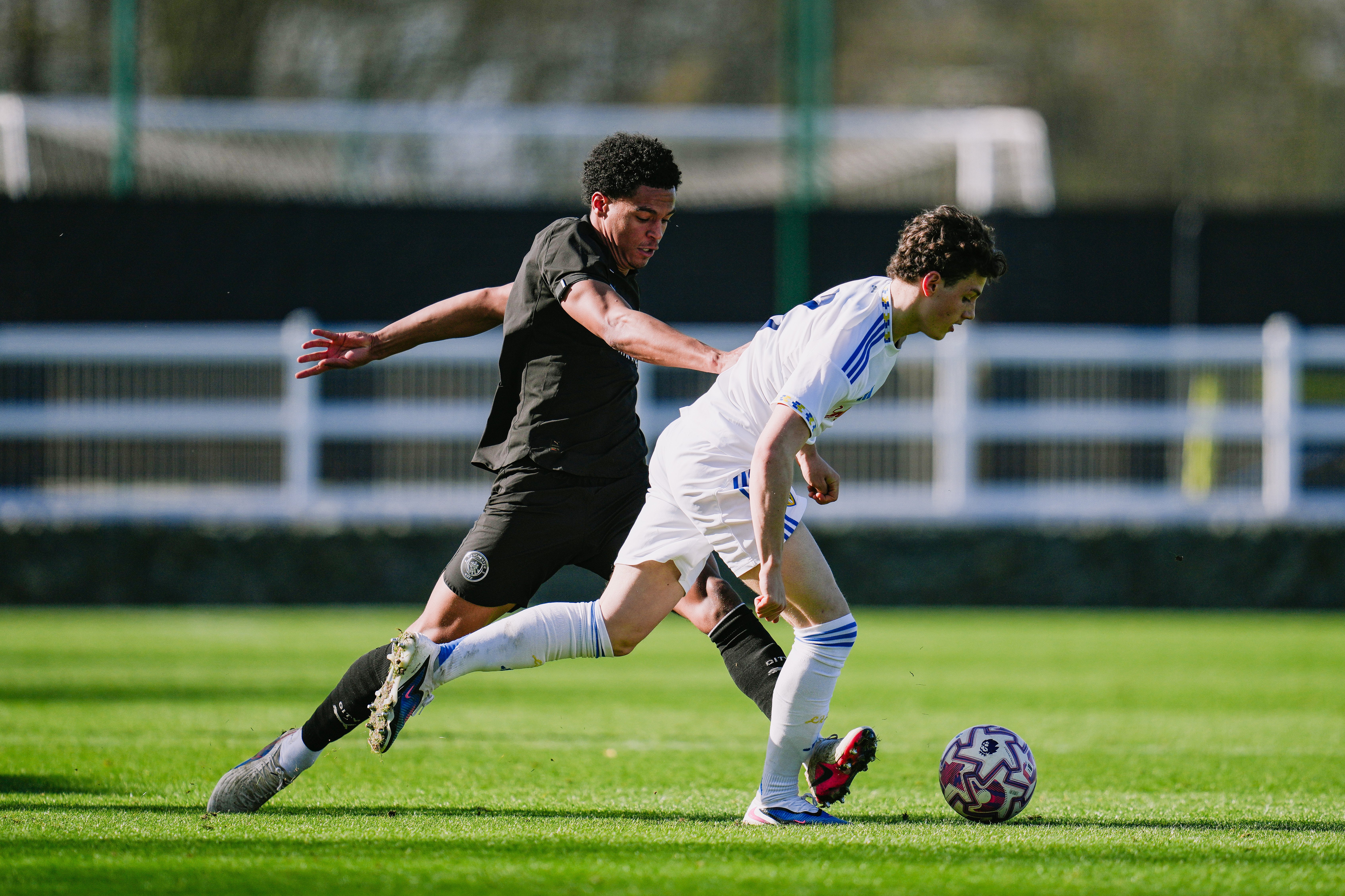 DEFENSIVE DUTIES : Leke Drake puts in a vital tackle.