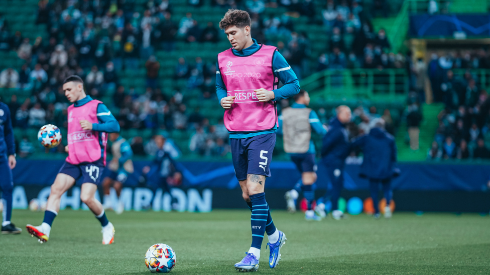 BACK IN THE XI : Stones gets a feel for the ball ahead of kick-off.