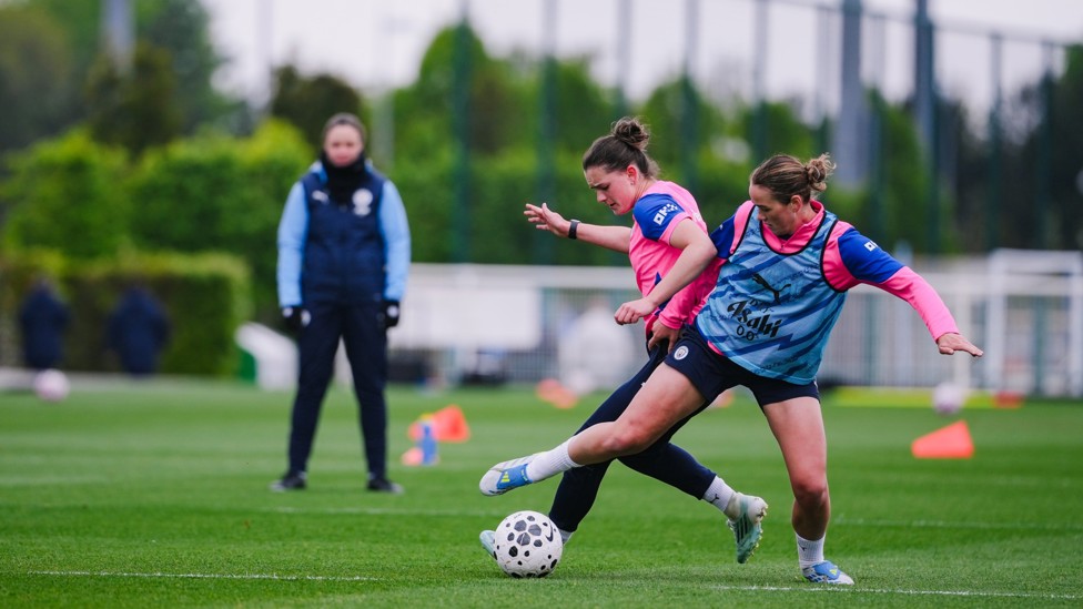 GETTING STUCK IN: Grace Clinton attempts to steal the ball from Lily Murphy