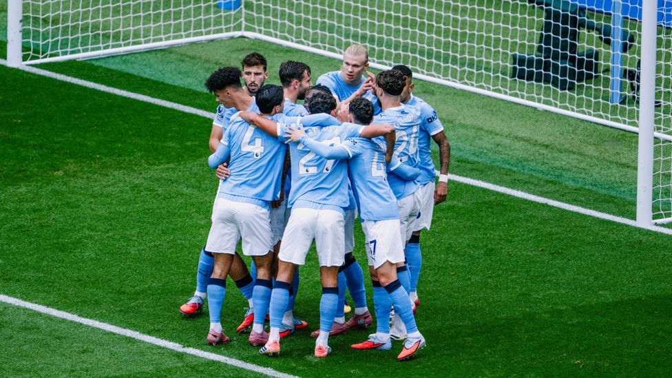 FIRED AHEAD: City players celebrate as we go 1-0 up