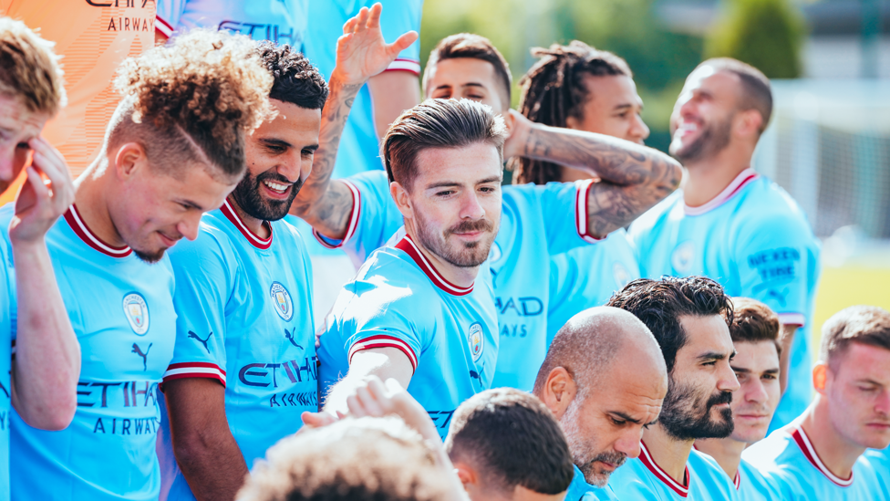 Jack Grealish examines Phil Foden's haircut