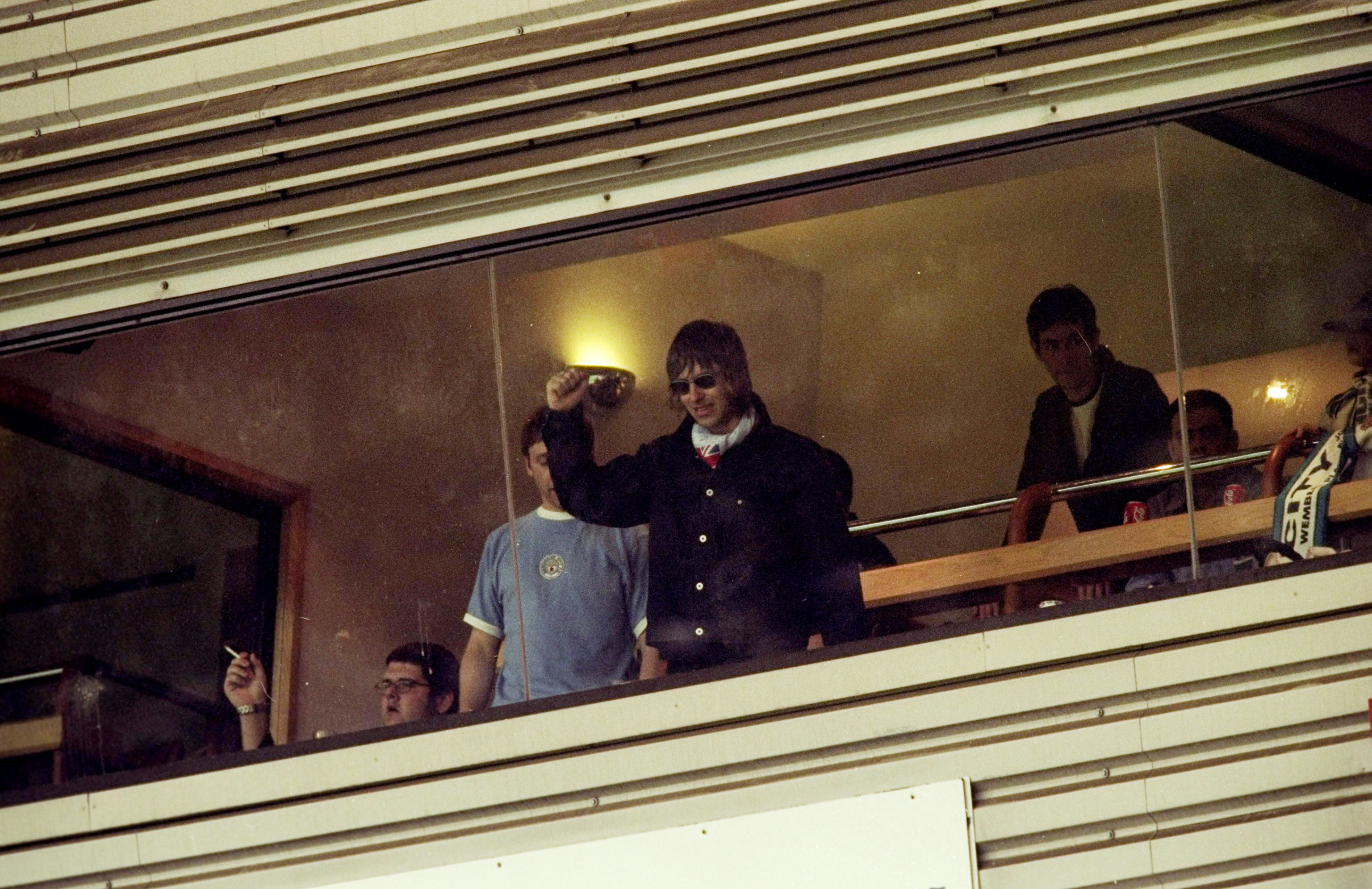TRIUMPHANT : Liam Gallagher acknowledges the fans at Wembley ahead of City's Division Two play-off final win against Gillingham.