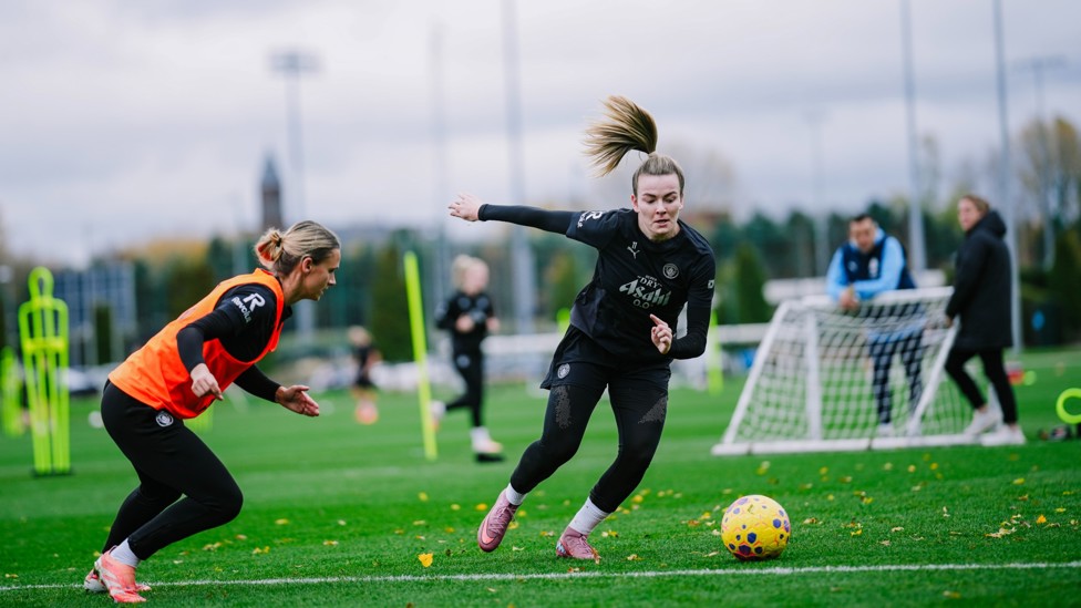 DEFYING GRAVITY: Lauren Hemp drives forward against Kerstin Casparij