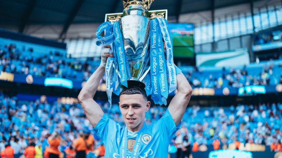 PHIL-ING GOOD: Who needs a hat when you have the Premier League trophy!