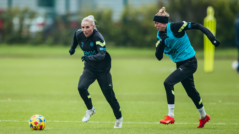 FOOT RACE : Alex Greenwood and Esme Morgan in the thick of the action