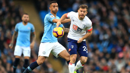 MY BALL: Danilo and Ryan Fraser battle for possession 