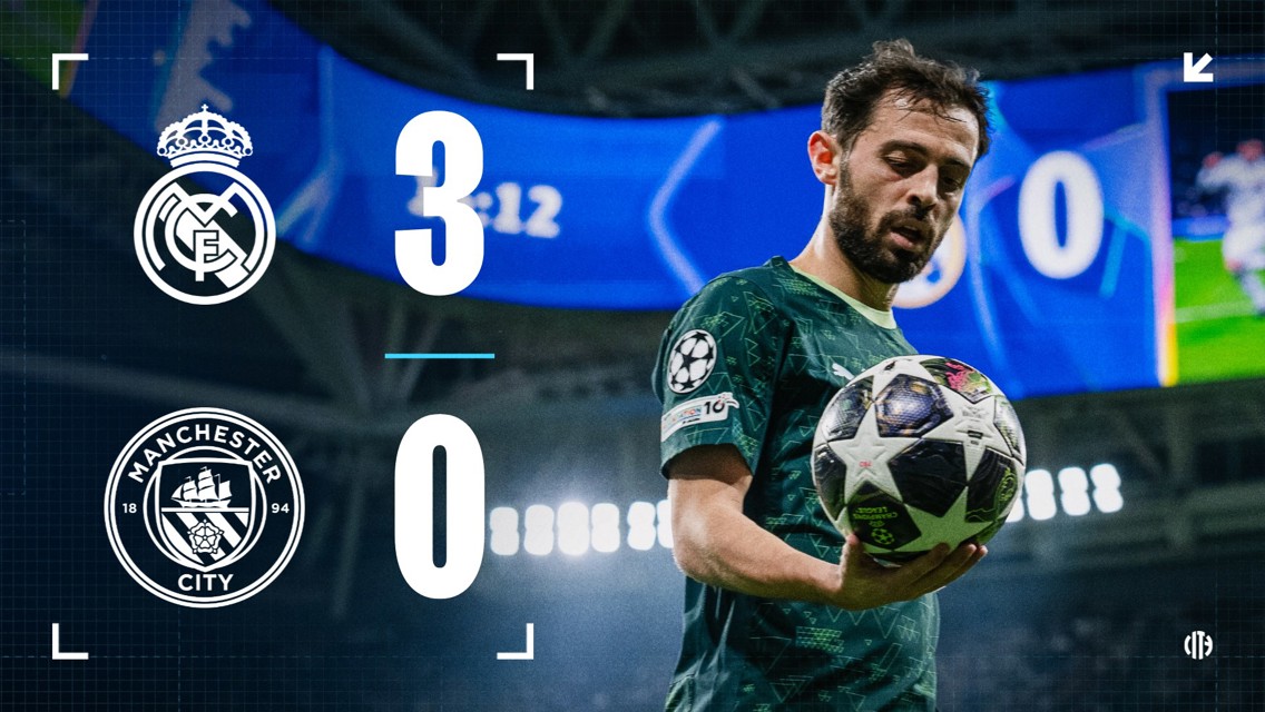 A scoreboard showing Real Madrid 3-0 Manchester City with blurred player holding a ball in a stadium.