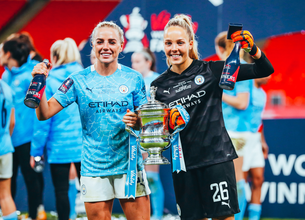 CHAMPIONS : Greenwood lifts the trophy with Ellie Roebuck following our 3-1 victory over Everton