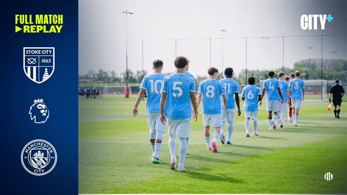 Manchester City players in blue jerseys walk towards the pitch for a match against Stoke City, with 'Full Match Replay' text on the left.