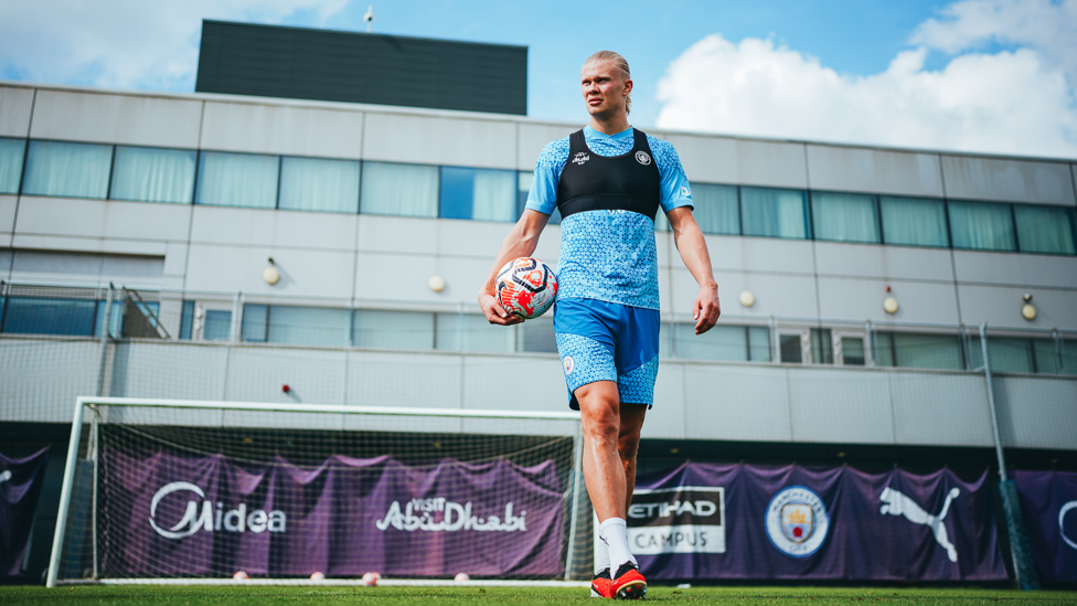 STRIKING VIKING : Erling Haaland strides across the training pitch
