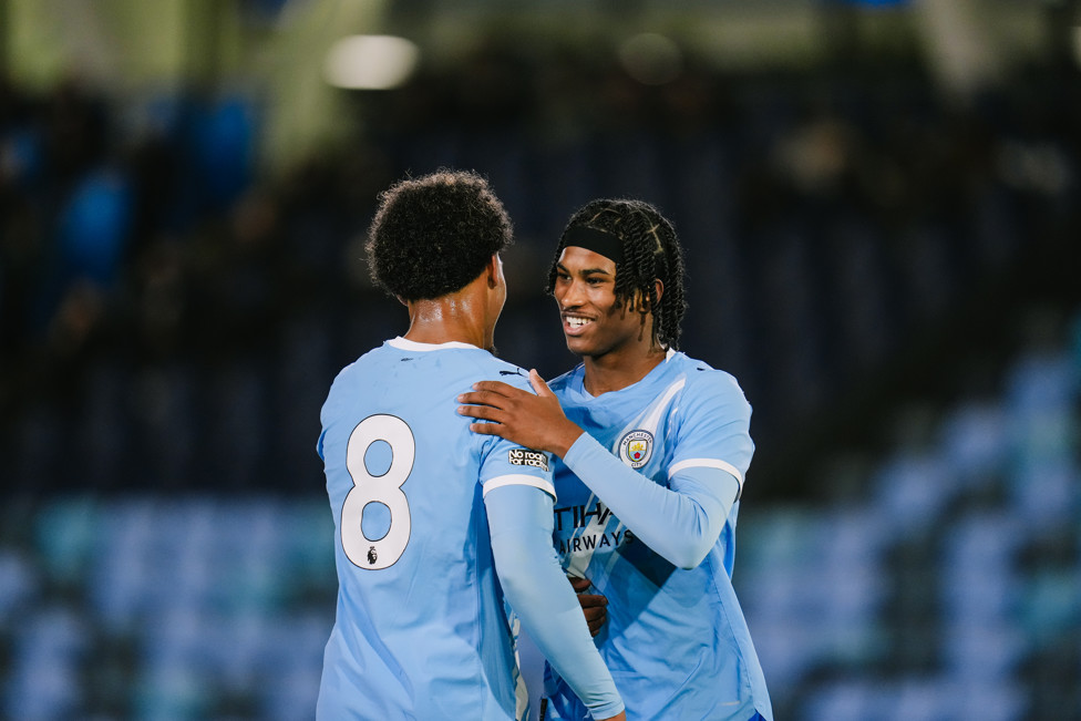 CELEBRATIONS ALL ROUND : Floyd Samba and Reigan Heskey celebrate another win at home.