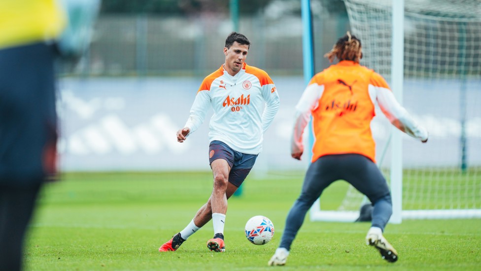 MIDFIELD MAESTRO : Rodrigo passes the ball forward.