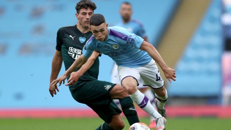 FO-RUN: The lively Foden looks to escape the clutches of Schar.