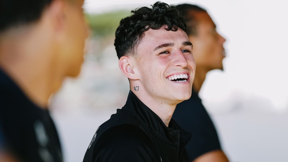 GOOD MOOD : Phil Foden is happy after his goal and assist against Huddersfield