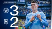 Scoreboard showing Manchester City 3-2 Ipswich Town. A player in Manchester City's kit is celebrating. Eight-minute highlights, presented by Etihad Beyond Borders.