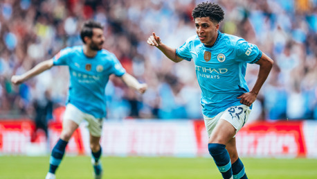 LOVELY LEWIS: Celebrates the goal.