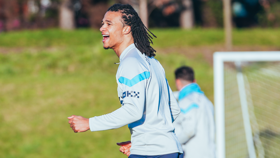 SUNNY DISPOSITION : Nathan Ake enjoys the bright weather on a cold day in Manchester