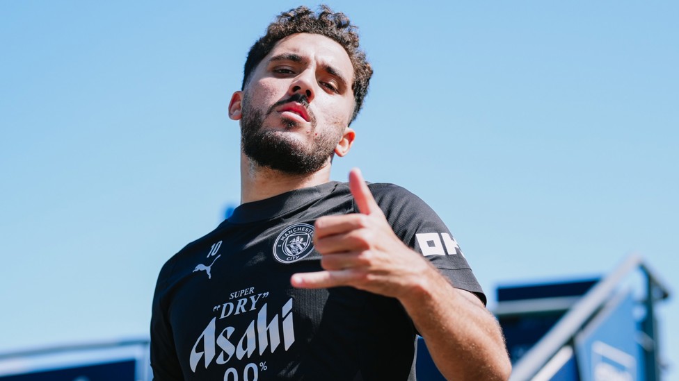 COOL AS YOU LIKE : Rayan Cherki heads out to training. 