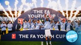 Football team celebrating their victory in the FA Youth Cup with fireworks and trophy.