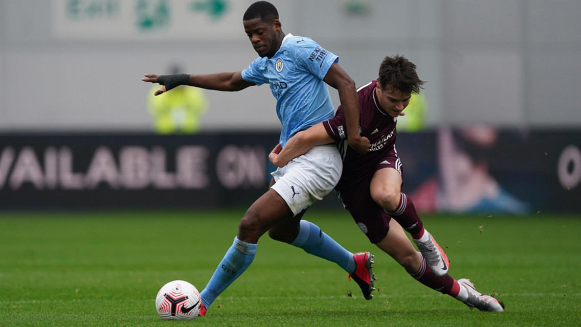 MBETE-RING RAM: Luke Mbete muscles possession away from Jake Wakeling