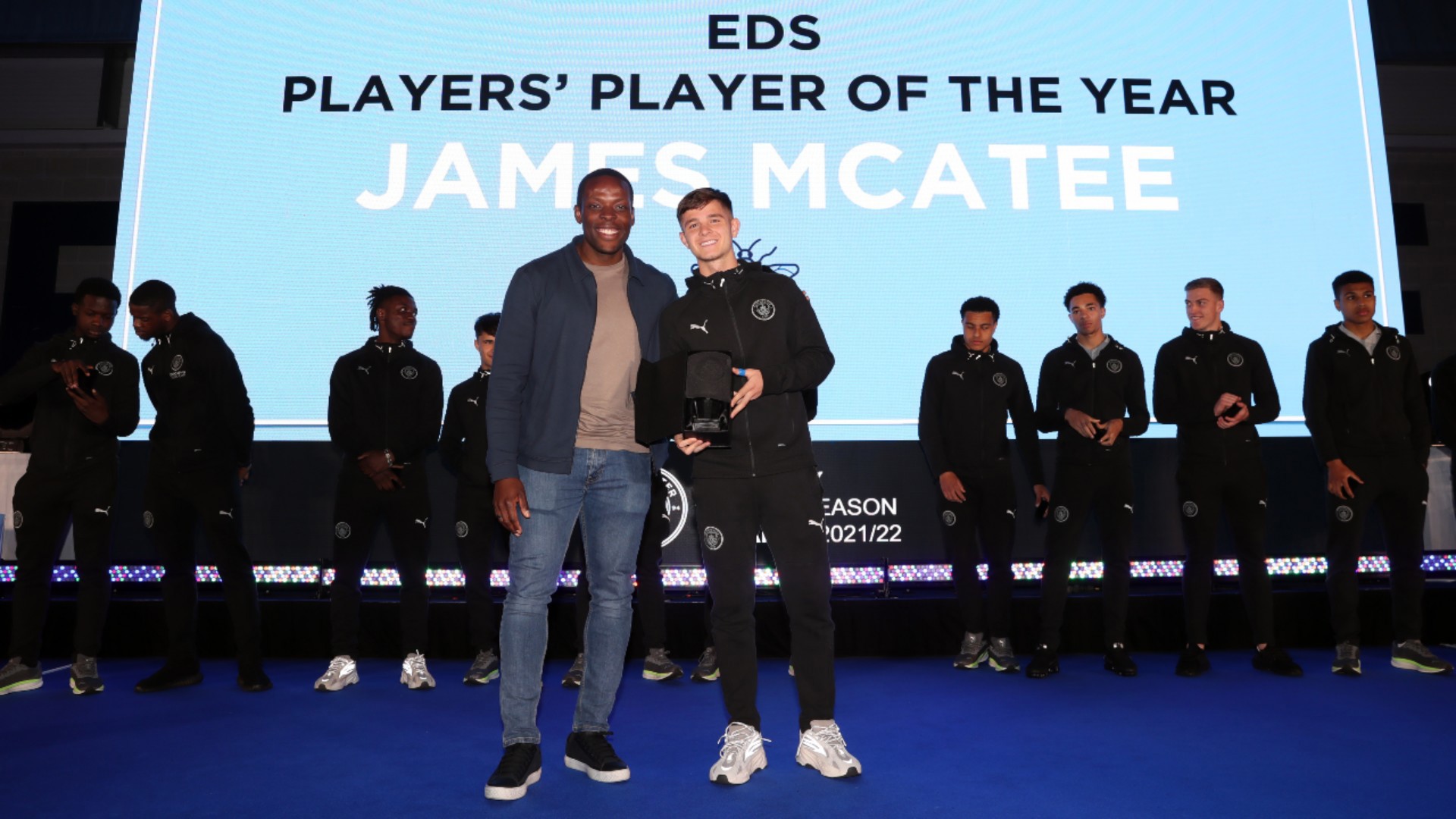 AWARD WINNER: James McAtee celebrates with former City star Nedum Onuoha