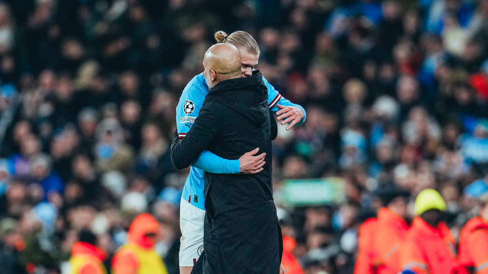 WHAT A SIGHT : The boss shares a warm embrace with Haaland.
