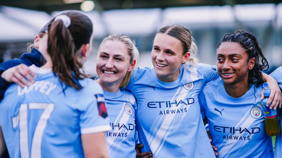 SQUAD GOALS : The players celebrate the win with Coombs