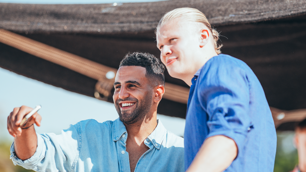 SUNNY SMILES : Mahrez and Haaland share a joke