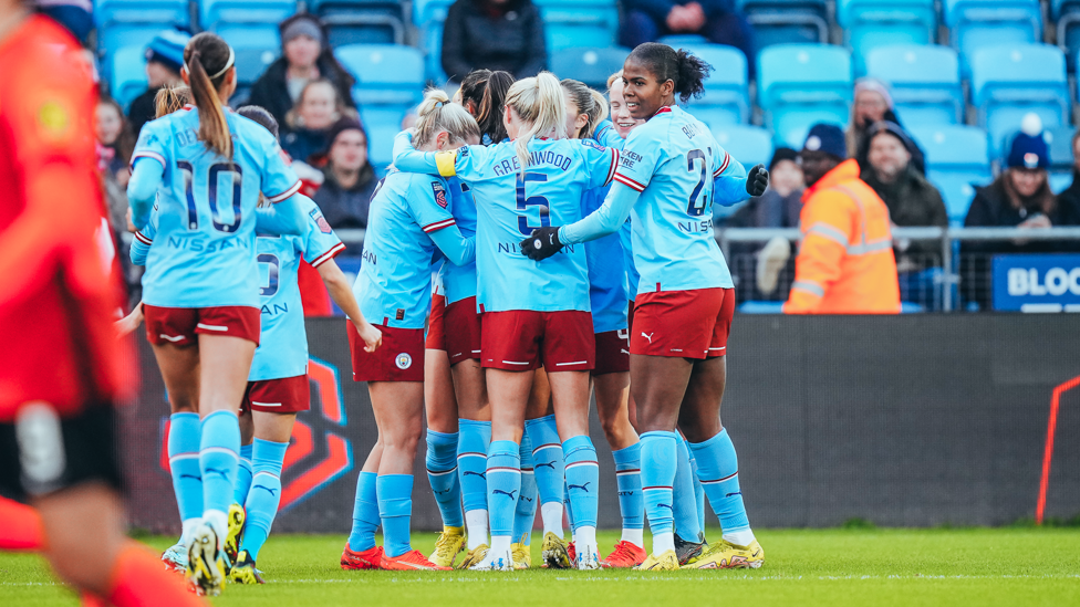 CELEBRATION TIME: The City players celebrate after Laura Coombs'  strike