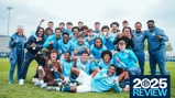 A group photo of Manchester City football team players and staff wearing light blue kits celebrating on a grass field. The image includes a '2025 Review' graphic on the bottom right.