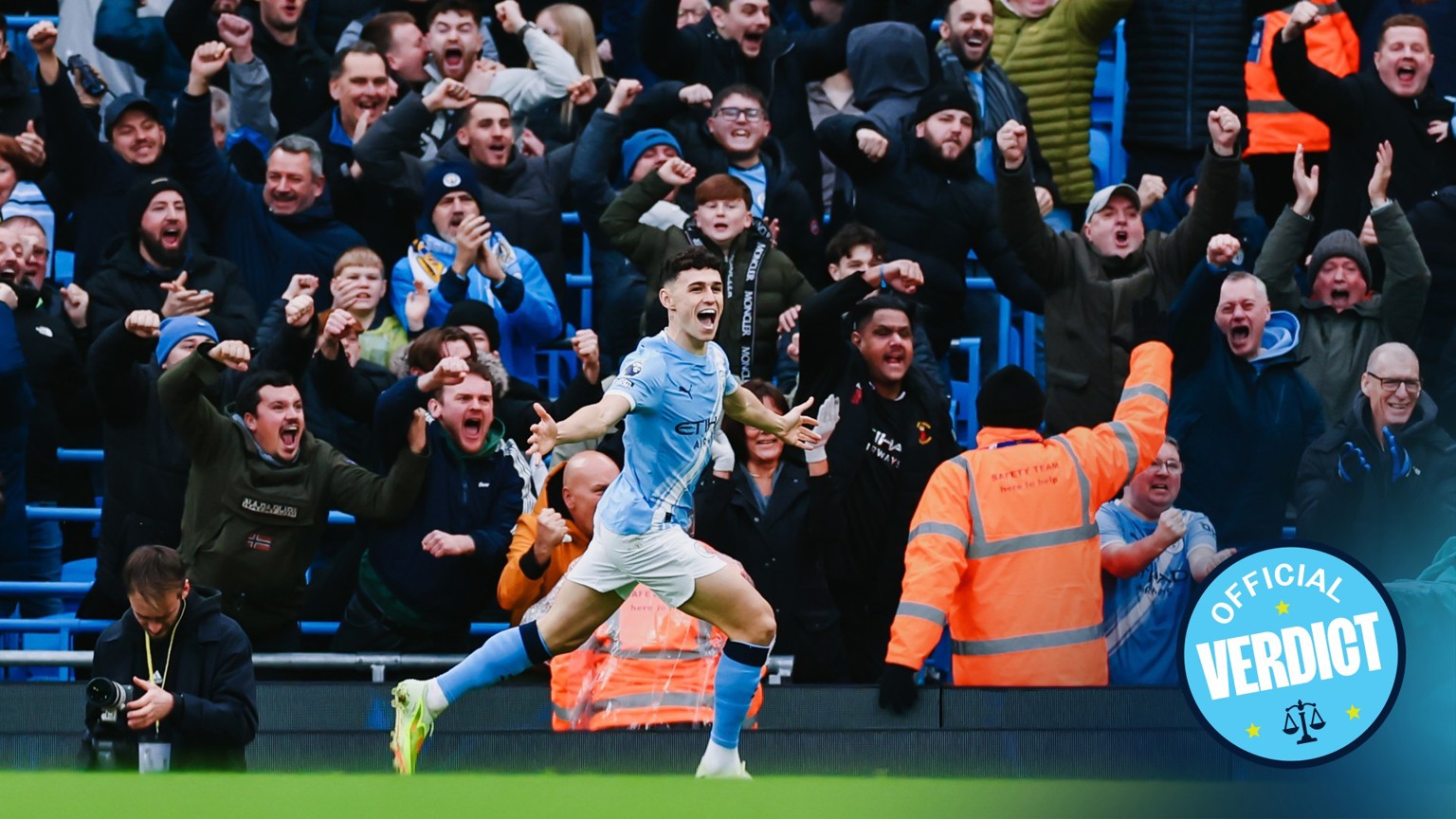 Manchester City player Phil Foden celebrates in front of jubilant fans at the Etihad Stadium with their faces blurred. The image includes a 'VERDICT' symbol.